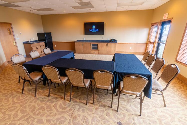 The Spinnaker Room features a large flat-screen TV and small kitchenette