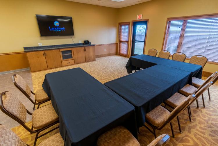 The Spinnaker Room features a large flat-screen TV and small kitchenette